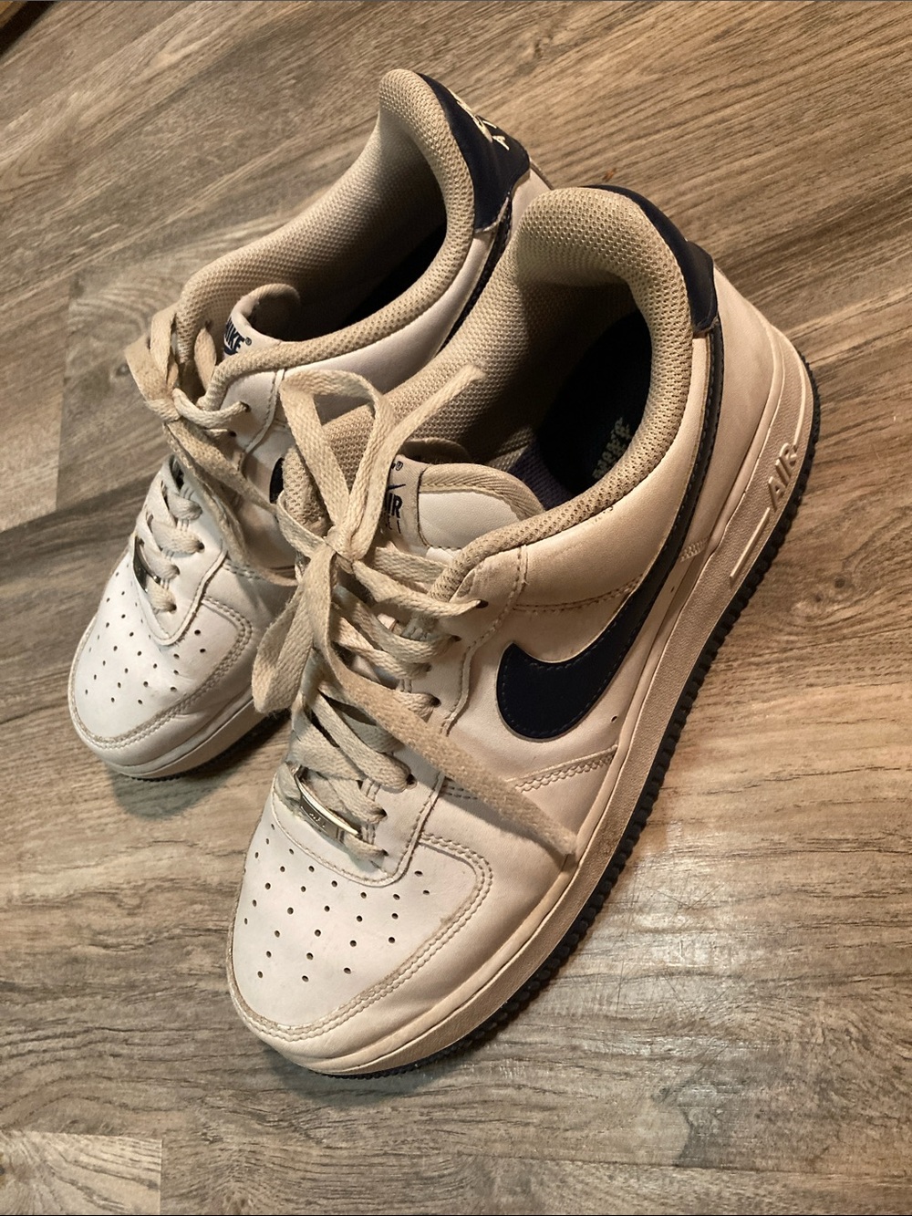Nike Air Force 1 White Sneakers with Navy Swoosh